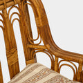 A Vintage French Rattan Sofa with Scroll Detail