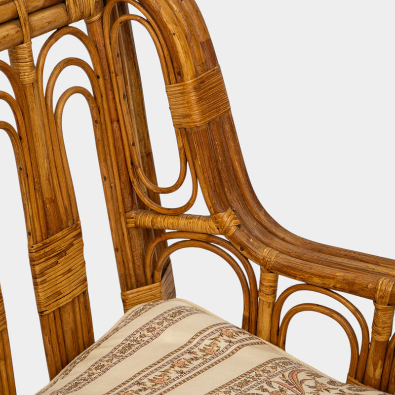 A Vintage French Rattan Sofa with Scroll Detail