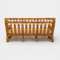A Vintage French Rattan Sofa with Scroll Detail