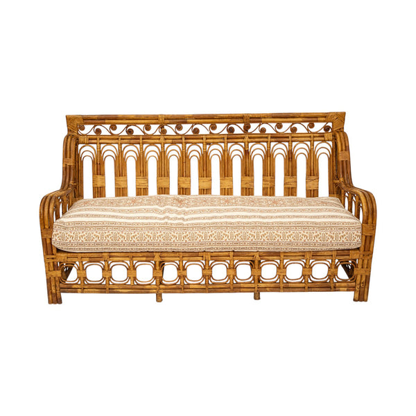 A Vintage French Rattan Sofa with Scroll Detail