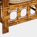 A Vintage French Rattan Sofa with Scroll Detail