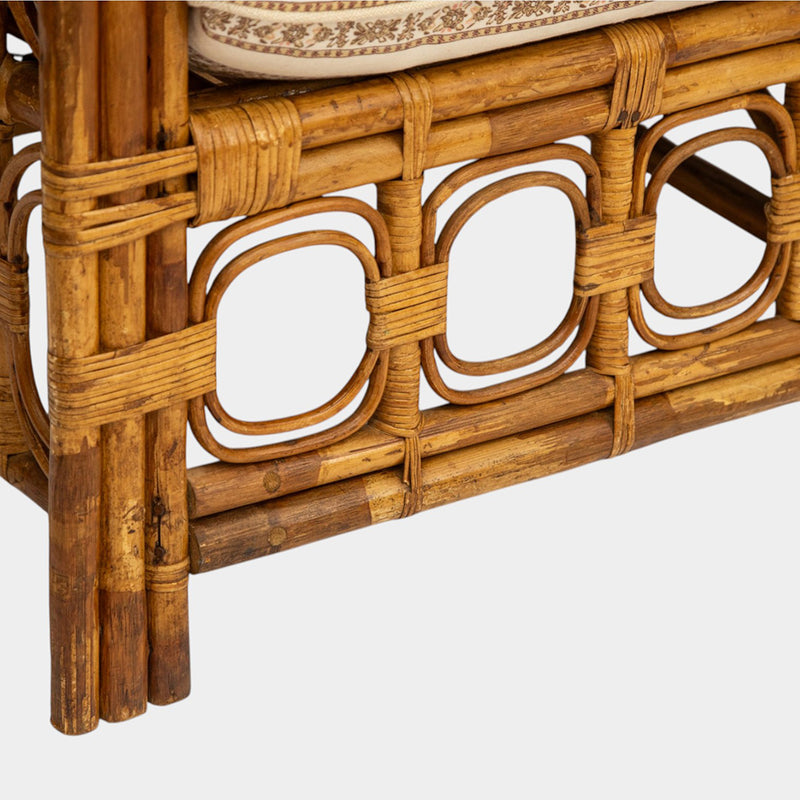 A Vintage French Rattan Sofa with Scroll Detail