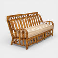 A Vintage French Rattan Sofa with Scroll Detail