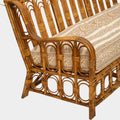 A Vintage French Rattan Sofa with Scroll Detail