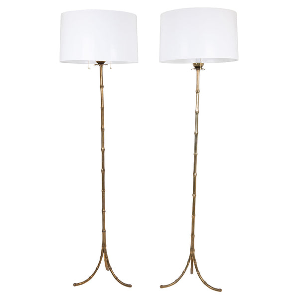 Pair of Faux Bamboo Two-Light Brass Standing Lamps with Tripod Feet in the Manner of Bagues
