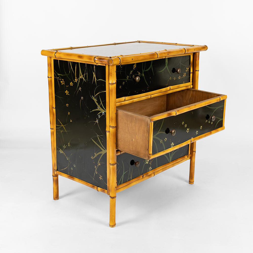 A Bamboo and Black Lacquered Chest with Hand Painted Floral Decor