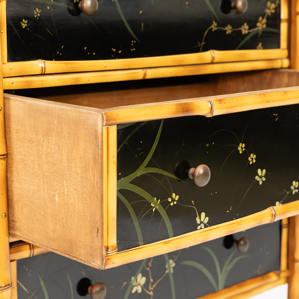 A Bamboo and Black Lacquered Chest with Hand Painted Floral Decor