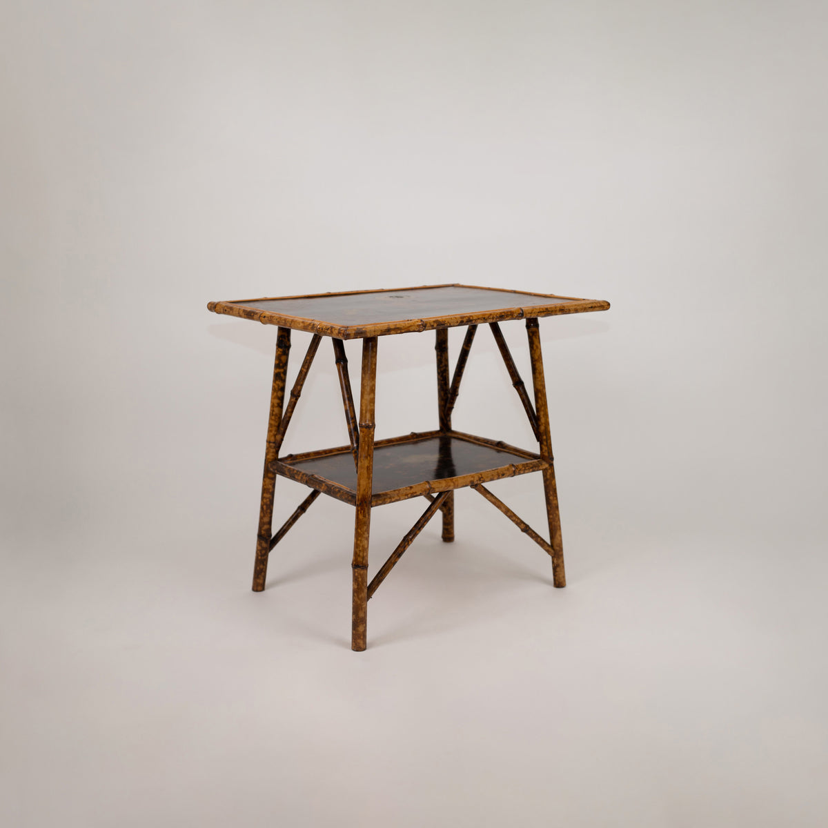 A Chinoiserie Decorated Bamboo Side Table in the manner of Jean-Baptiste Kohn