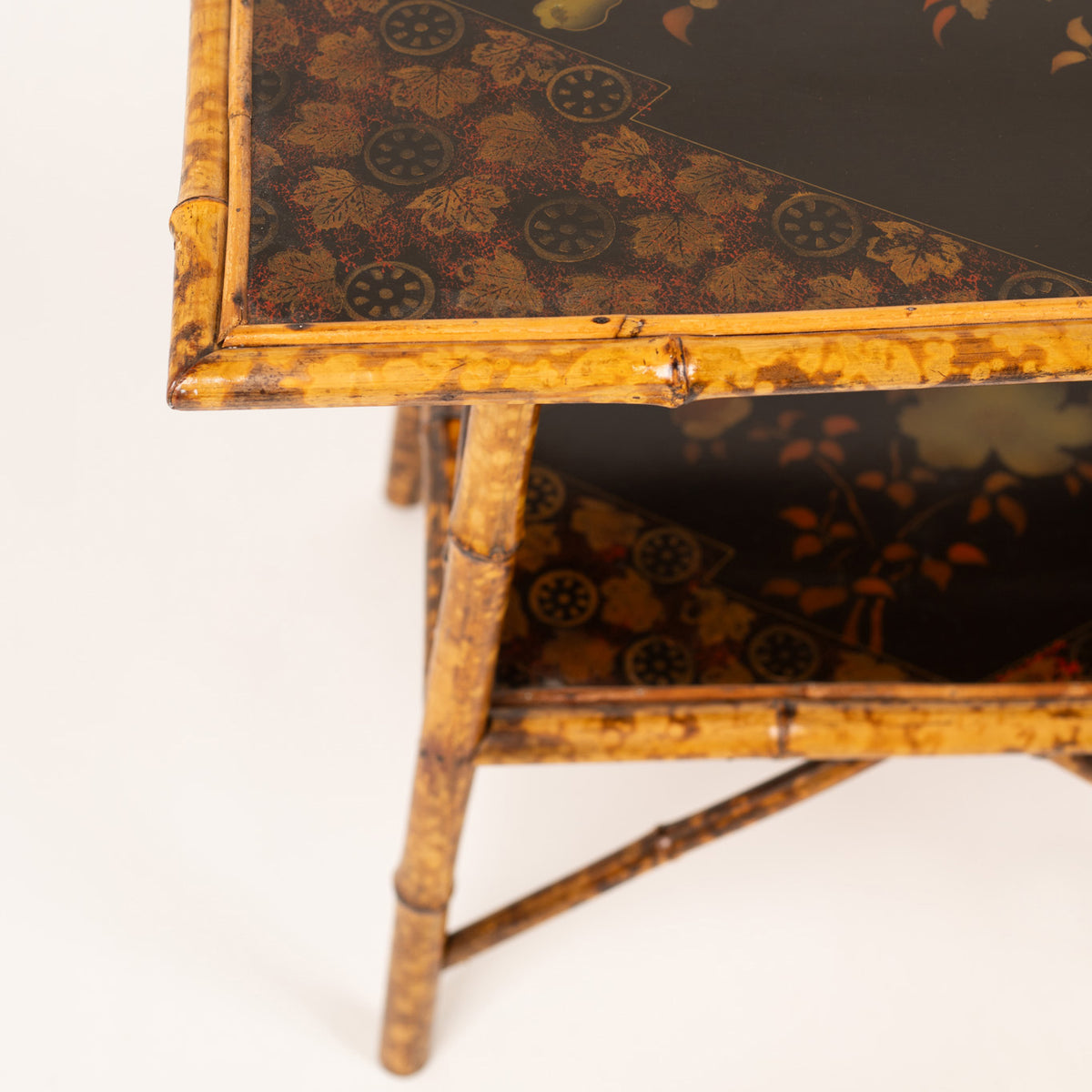 A Chinoiserie Decorated Bamboo Side Table in the manner of Jean-Baptiste Kohn
