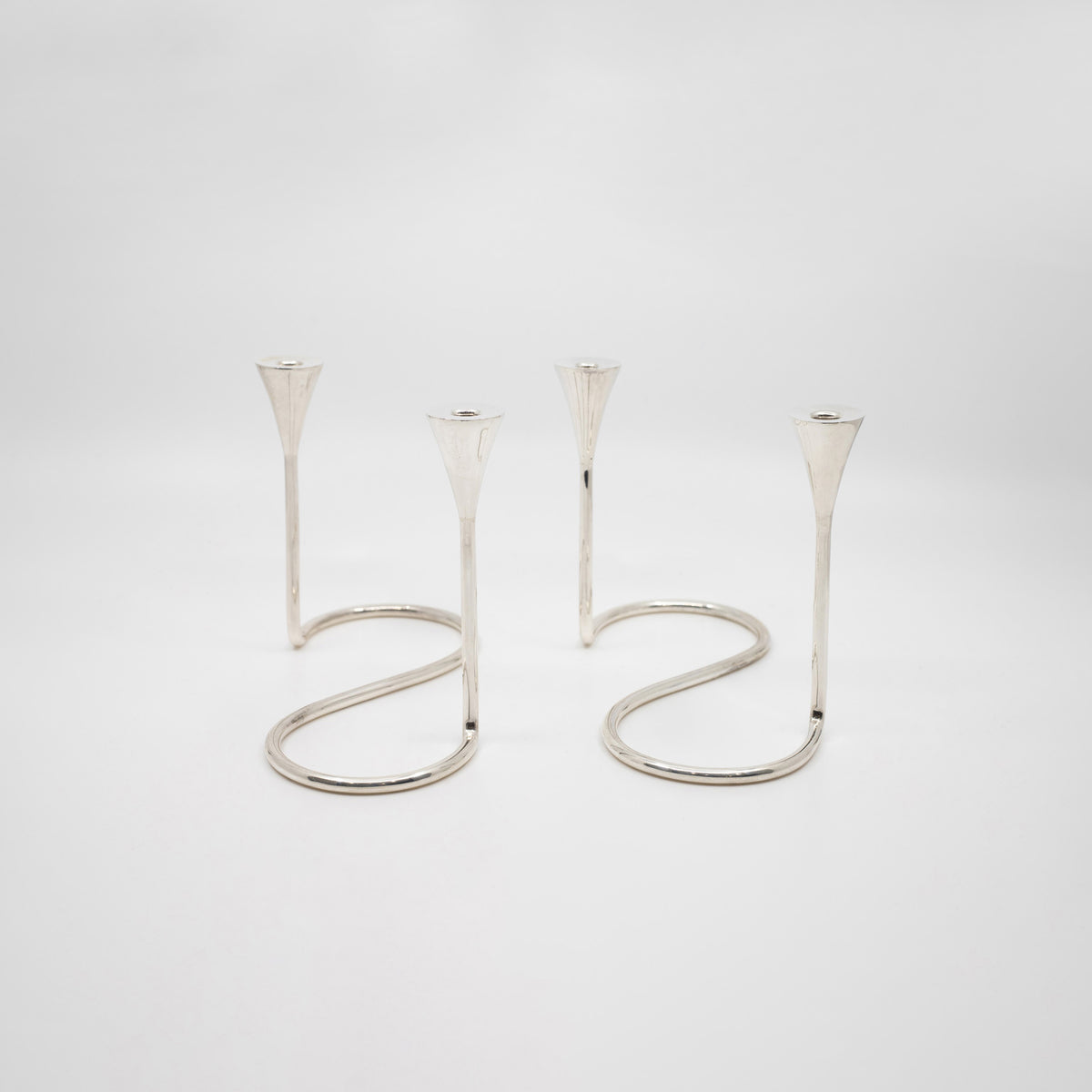 A Pair of Sterling Silver Modern Candelabras