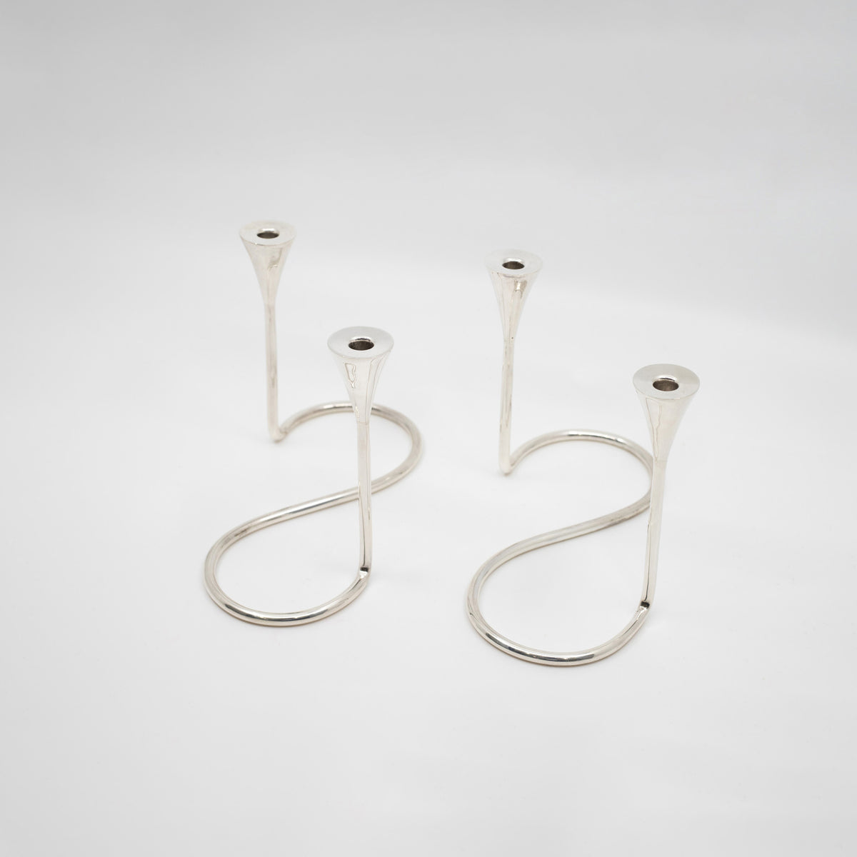 A Pair of Sterling Silver Modern Candelabras