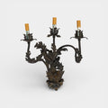 A Pair of French Wrought Iron Three-Arm Sconces