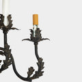 A Pair of French Wrought Iron Three-Arm Sconces