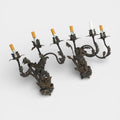 A Pair of French Wrought Iron Three-Arm Sconces