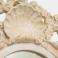 A Pair of Rococo Style Shell Form Mirrors