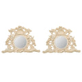A Pair of Rococo Style Shell Form Mirrors
