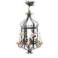 A Brass and Wrought Iron Chandelier with Painted Ceramic Flowers