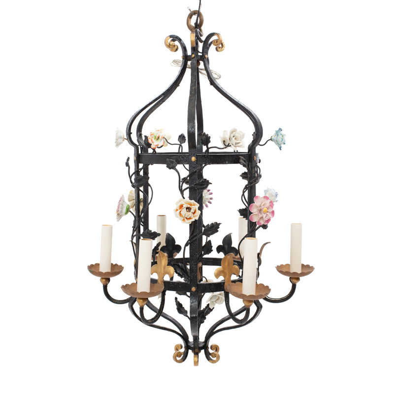 A Brass and Wrought Iron Chandelier with Painted Ceramic Flowers
