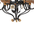 A Brass and Wrought Iron Chandelier with Painted Ceramic Flowers