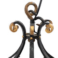 A Brass and Wrought Iron Chandelier with Painted Ceramic Flowers