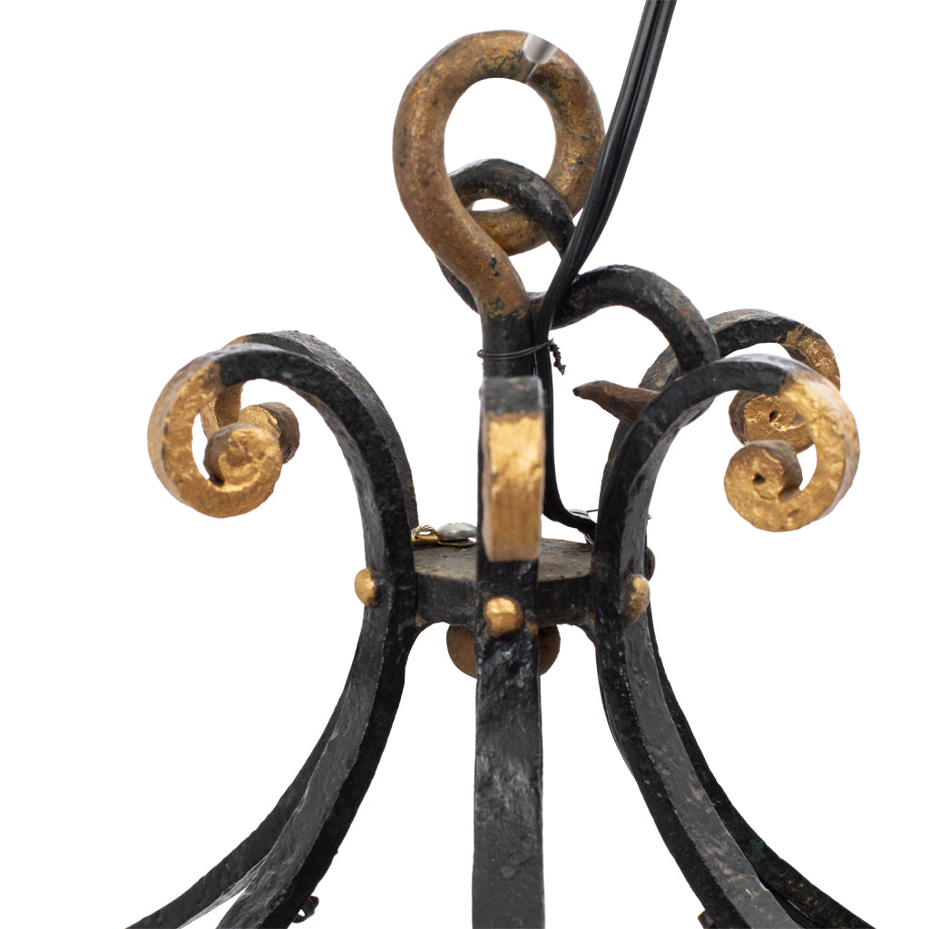 A Brass and Wrought Iron Chandelier with Painted Ceramic Flowers