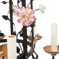 A Brass and Wrought Iron Chandelier with Painted Ceramic Flowers