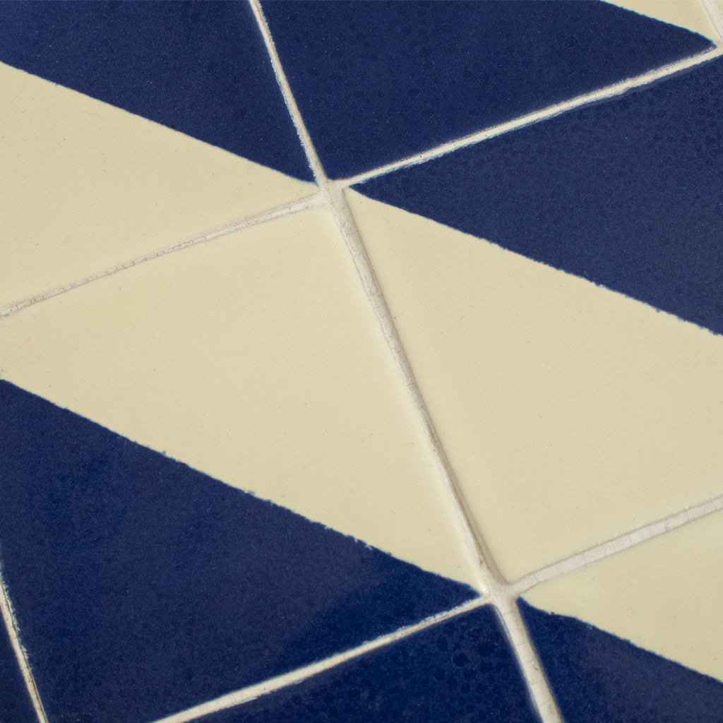 A Set of Four Vintage Wrought Iron Outdoor Side Tables with Blue and White Glazed Tile Tops